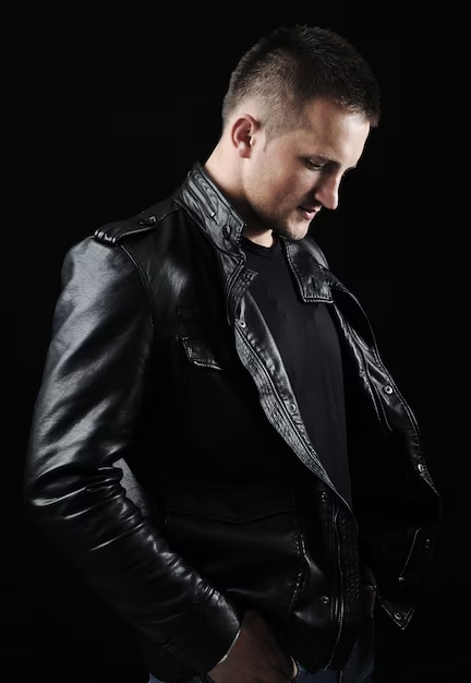 stylish-fashion-young-man-portrait-with-leather-jacket-black-background_21730-8347